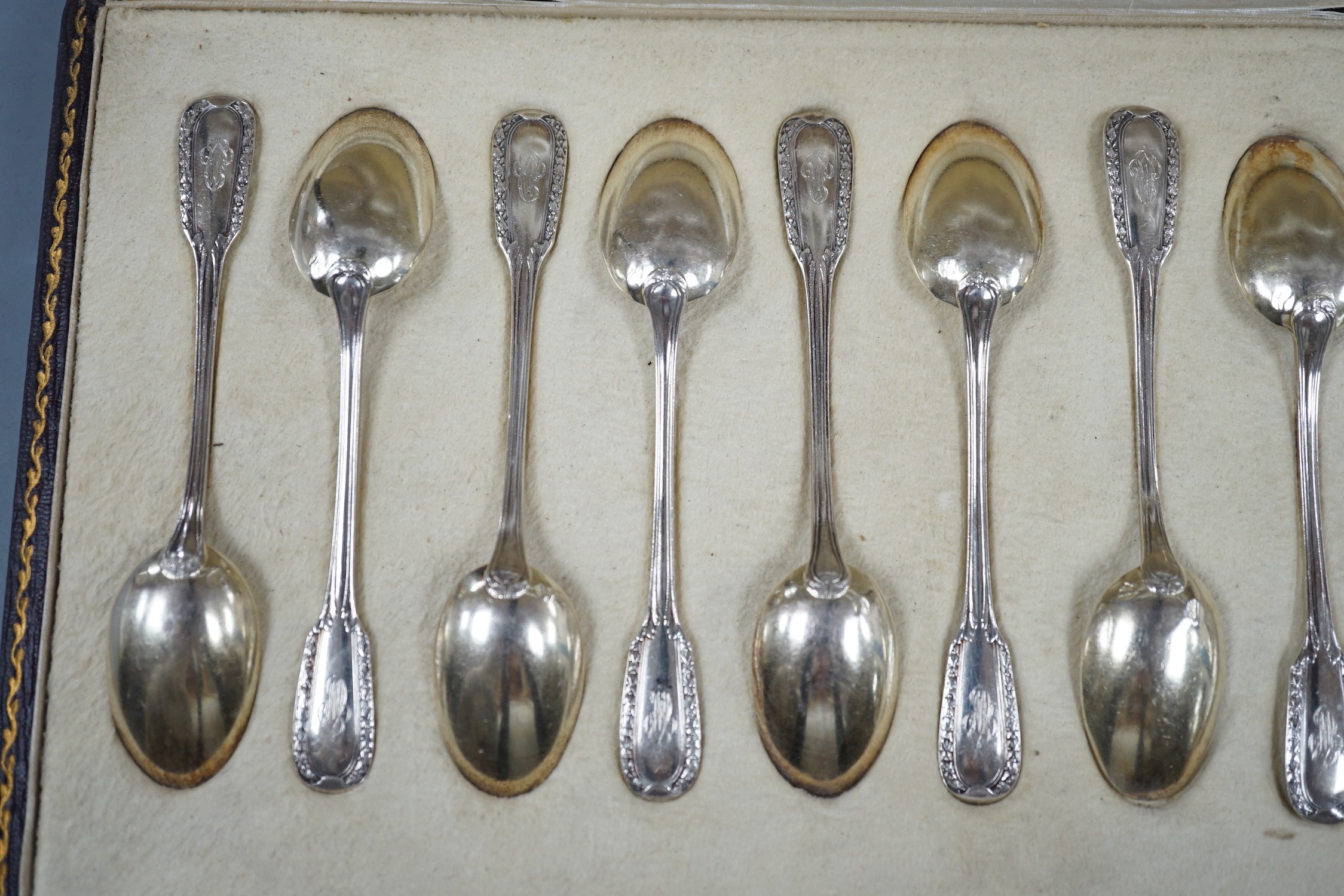 A cased set of twelve early 20th century French 950 white metal teaspoons by Emile Puiforcat, retailed by Louis Rey, 10.5cm.